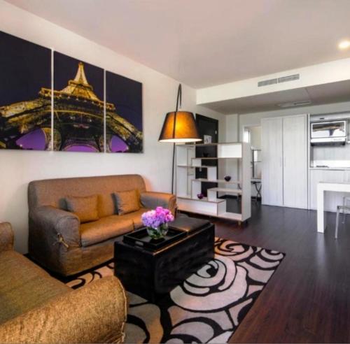 a living room with a couch and a table at Pegass hotel in Yerevan