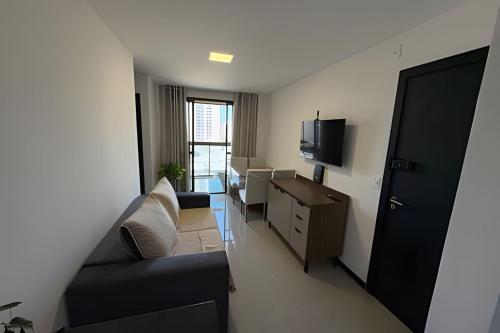 TV/trung tâm giải trí tại Excelente apartamento a 3 quadras da praia