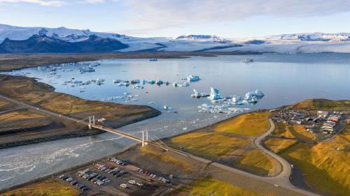 an aerial view of a body of water with a bridge at Guesthouse Mikael in Höfn