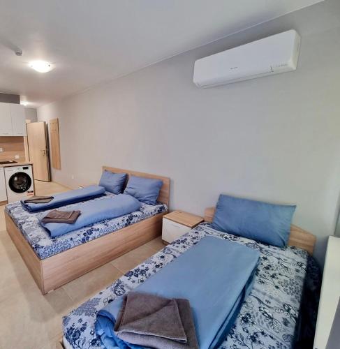 a room with two beds in a room at Flex loft in Sofia