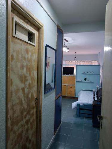 an open door to a room with a bedroom at Magnolia Vintage in San Bernardo