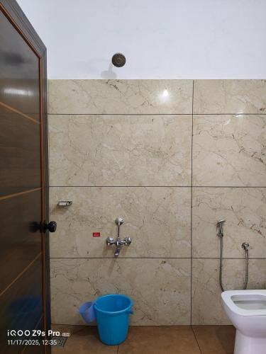 a bathroom with a toilet and a shower stall at Thazhvaram Pool Villa Idukki Calvary Mount in Idukki