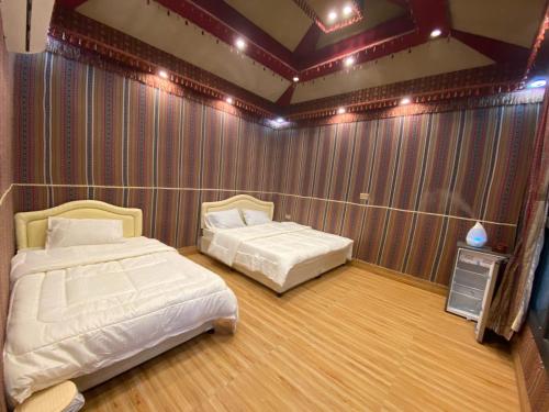 Ένα ή περισσότερα κρεβάτια σε δωμάτιο στο Sun Horizon Chalet