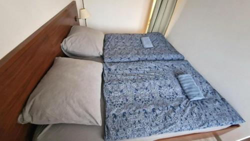 a small bed in a small room with a mattress at Drazdiak House Antolska Lake View in Bratislava