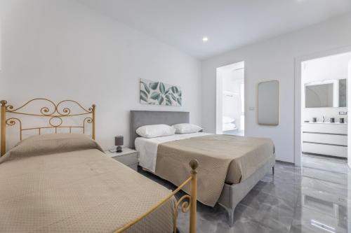 Ένα ή περισσότερα κρεβάτια σε δωμάτιο στο Sole Apartment