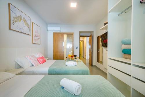 Ένα ή περισσότερα κρεβάτια σε δωμάτιο στο ITNC024- Apê com 4 quartos na Av. Atlântica de BC