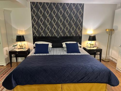 Кровать или кровати в номере Le studio Chez Marilé