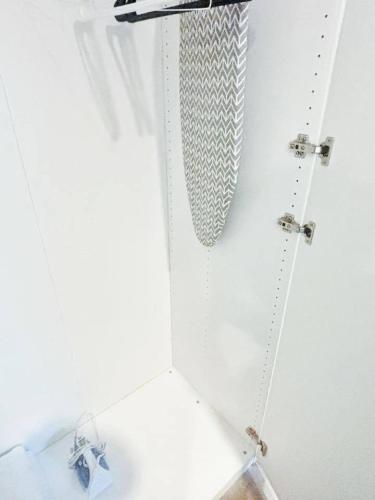 a white cabinet with a star hanging from it at Indigo Studio in Des Moines