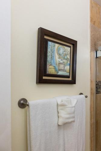 a towel hanging on a towel rack in a bathroom at The Beach Nook at Turtle Bay in Kahuku