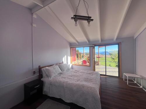 Ένα ή περισσότερα κρεβάτια σε δωμάτιο στο Hospedaje el juncal