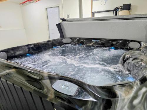 a hot tub filled with water in a machine at The Monarch at Monarch Mine (Unit A, upper level) in Girdwood