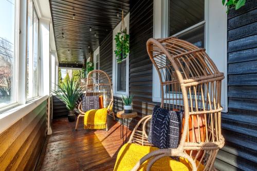 a porch with two rocking chairs and windows at Downtown Columbus & Short North 2BR Home - Sleeps up to 10 Guests - By Convention Center & Nationwide Arena - Free Parking - Over 5,800 Five Star Stays - Casita Verde by Jungle House in Columbus