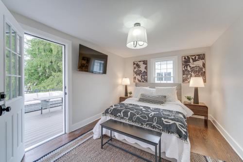 a bedroom with a bed and a balcony at Explore Cleveland Attractions! Family-Focused Home in Beachwood