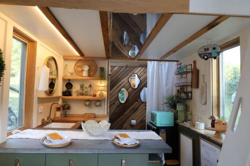 a kitchen with a sink and a counter in a room at Mountain Hike, Firepit & Farm Animals in Gilmanton