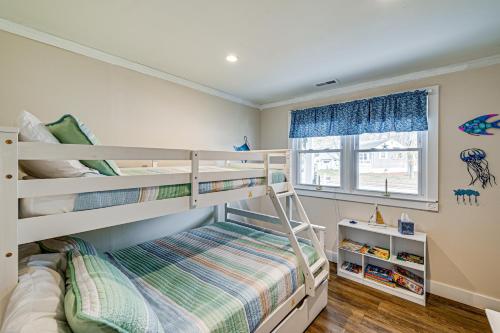 a bedroom with two bunk beds and a window at 2 Mi to Beach Holiday Home in North Cape May in North Cape May