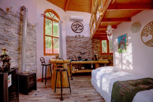 Postel nebo postele na pokoji v ubytování Andesenios Los Esenios de los Andes