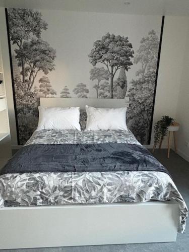 En eller flere senge i et værelse på Gîte de La Ville Bresset