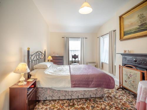 a bedroom with a bed and a dresser and a window at 3 Bed in Bruree oc-i207 in Brú Rí