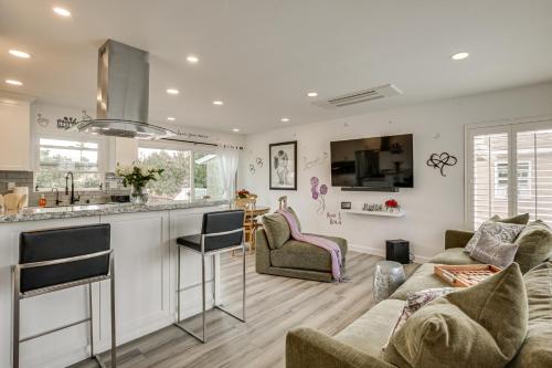 a kitchen and living room with a couch and a table at Breeze by the Marina Chula Vista Getaway! in Chula Vista