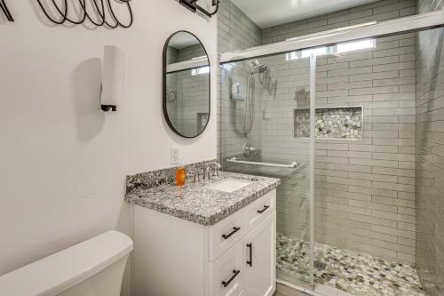 a white bathroom with a sink and a shower at Breeze by the Marina Chula Vista Getaway! in Chula Vista