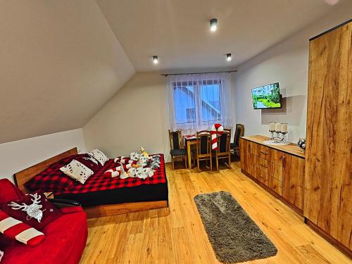 Una cama o camas en una habitación de Apartamenty u Beci I Cyryla