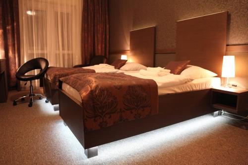 Ένα ή περισσότερα κρεβάτια σε δωμάτιο στο HOTEL CENTRUM with free parking