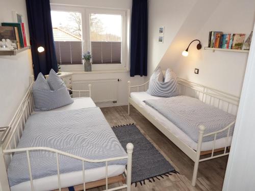 Ένα ή περισσότερα κρεβάτια σε δωμάτιο στο Kranichnest