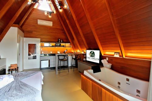 Televiisor ja/või meelelahutuskeskus majutusasutuses Chalé Semillon