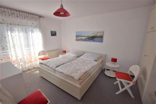 Postel nebo postele na pokoji v ubytování Ferienwohnung Sanddorn