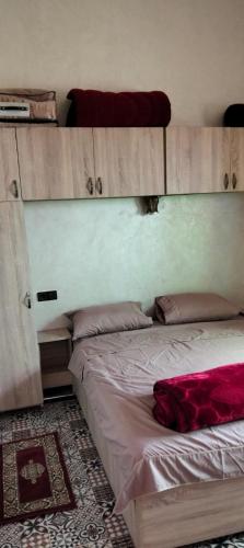 a bedroom with a bed with at Mhamid appartement in Mhamid