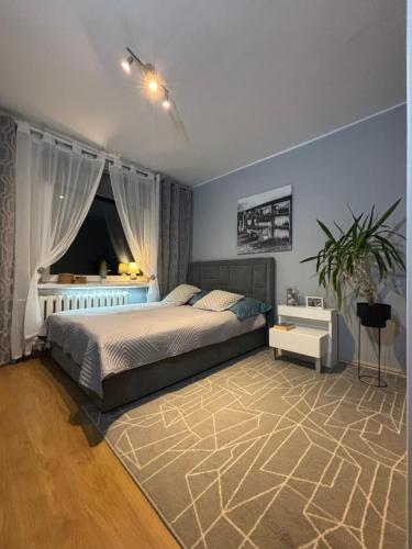 Postel nebo postele na pokoji v ubytování Gdynia Apartament Torpedownia