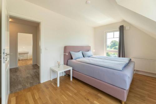 Ένα ή περισσότερα κρεβάτια σε δωμάτιο στο Ferienhaus Belvedere 2 c