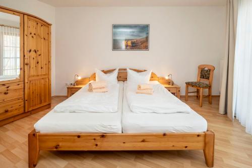 Ένα ή περισσότερα κρεβάτια σε δωμάτιο στο Ferienpark Freesenbruch Wohnung 1 1 - Seestern