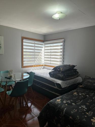 Postel nebo postele na pokoji v ubytování Hostal Verde Bendito Depto 2 Temuco