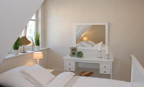 Postel nebo postele na pokoji v ubytování Neue Reihe 28 - Wohnung Kleine Auszeit