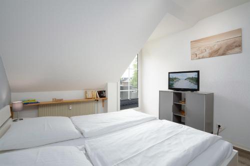 En eller flere senge i et værelse på TRA7 "Residenz Windrose" - App Reichelt