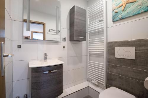 Et badeværelse på TRA7 "Residenz Windrose" - App Reichelt