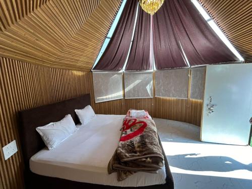a room with a bed in a tent at LA Foresta resort by Utopia in Shivpuri