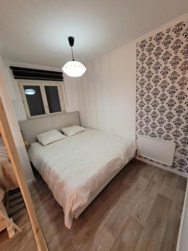 Ένα ή περισσότερα κρεβάτια σε δωμάτιο στο Era lodge