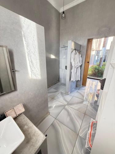 a bathroom with a shower and a sink and a shower at Villa Five Collection - Private Luxury & Heated Pool in Ouled Moumene