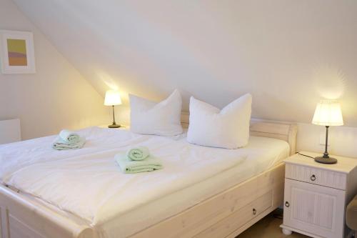 Postel nebo postele na pokoji v ubytování Strandperle - Anlage Heiderose