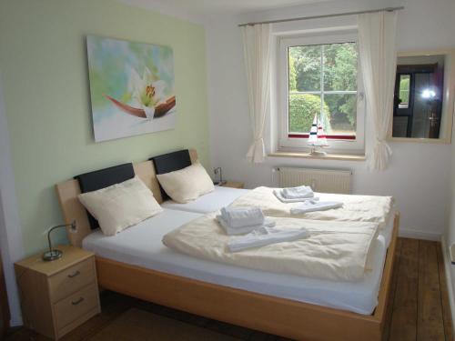 Postel nebo postele na pokoji v ubytování TRA7b "Residenz Windrose"