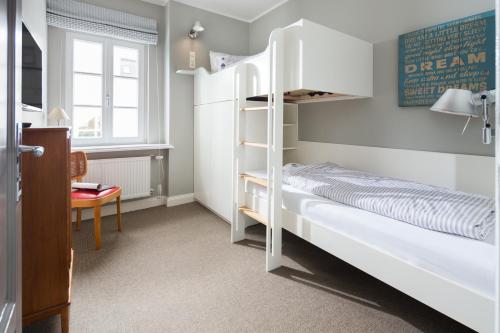 Ένα ή περισσότερα κρεβάτια σε δωμάτιο στο Kapitänshaus 1935