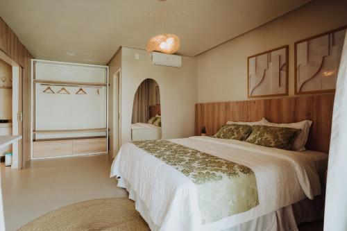 Ένα ή περισσότερα κρεβάτια σε δωμάτιο στο Pousada Bosque da Serra