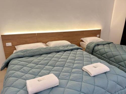 Postel nebo postele na pokoji v ubytování Hotel Brivio