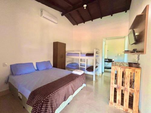 Postel nebo postele na pokoji v ubytování Chalés Vale da Roça