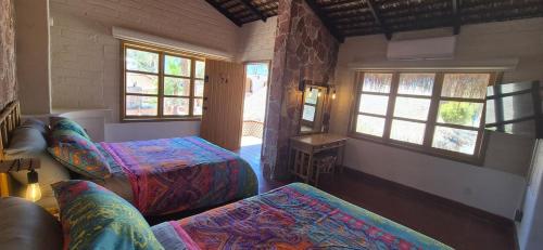 Postel nebo postele na pokoji v ubytování Sandy Shores Cabaña 7A