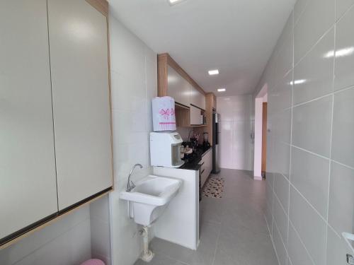 Køkken eller tekøkken på Apartamento pé na areia, no Centro de Mongaguá!