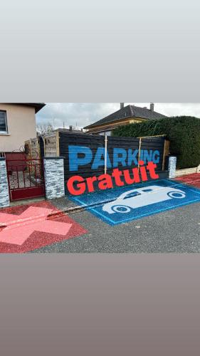 a painting of a batting cleanup sign on the side of a building at Les hirondelles in Battenheim