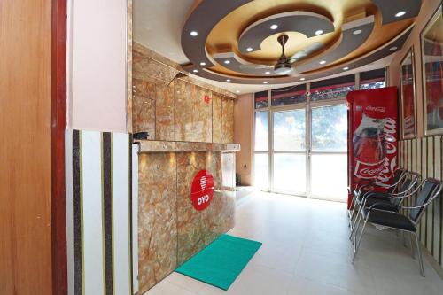 a room with cocacola soda signs on the wall at Hotel O Casa Nova in Transport Nagar